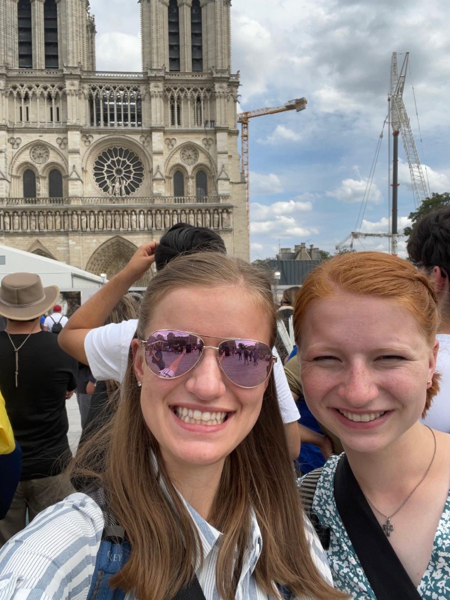 My older sister and me in front of the Notre Dame Cathedral in Paris, France  