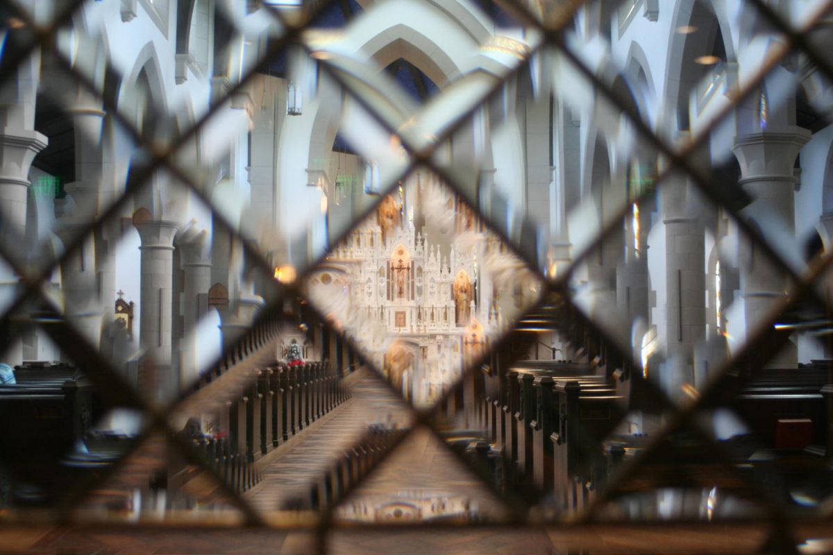 The altar viewed through the cut glass door of the narthex.